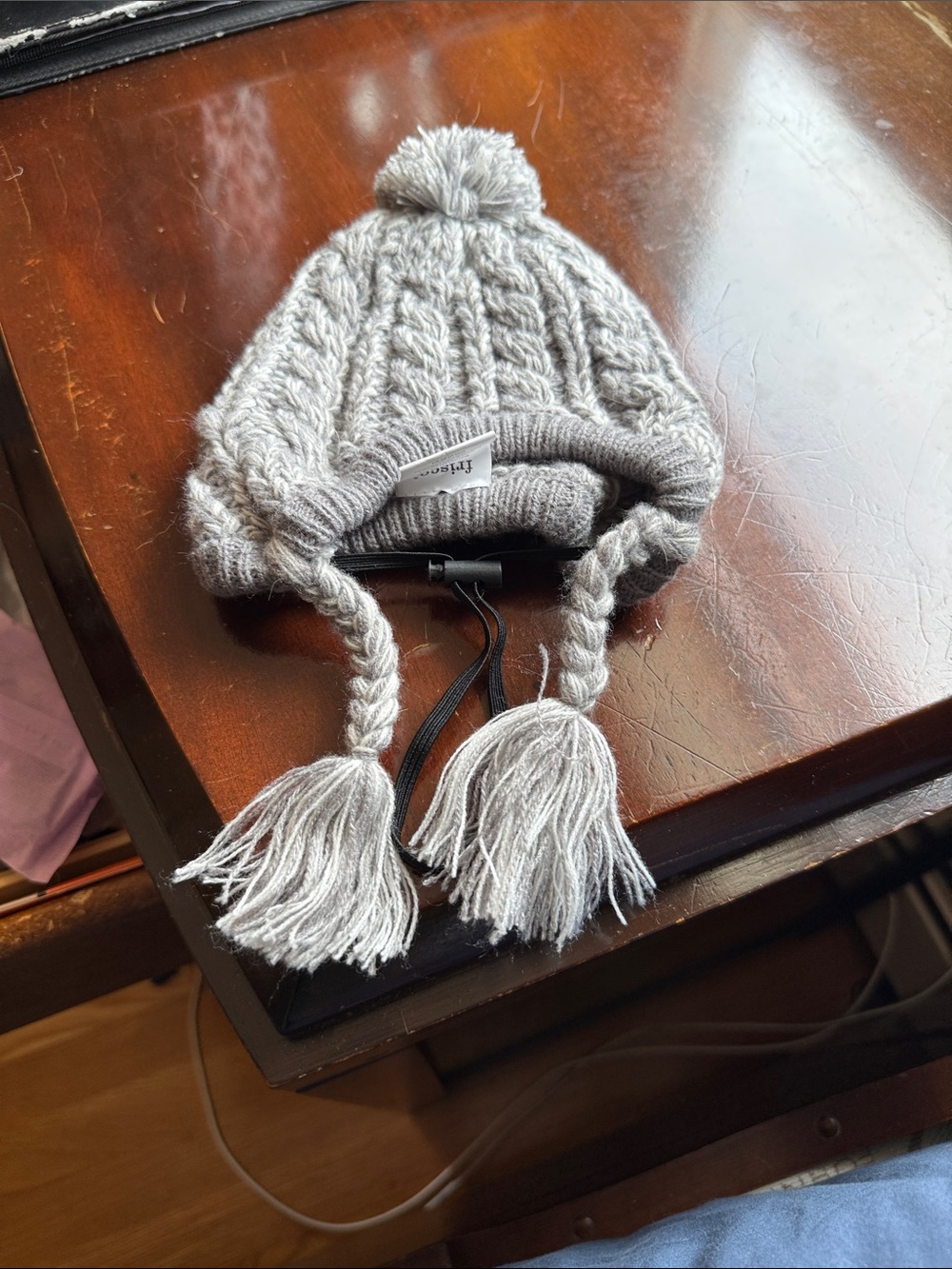 Gray knit winter hat for dogs with drawstrings
